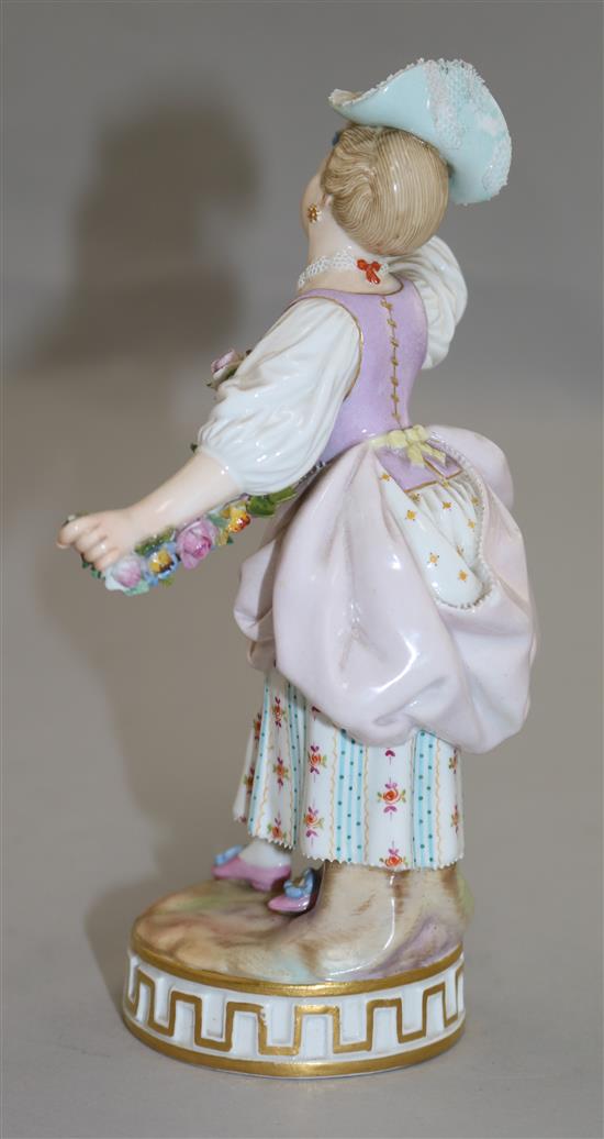A Meissen figure of a lady holding a garland of flowers, late 19th century, 17cm